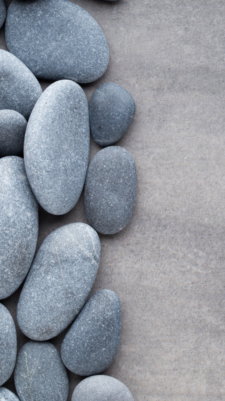 Blue Stones on Gray Textile. Wallpaper in 720x1280 Resolution