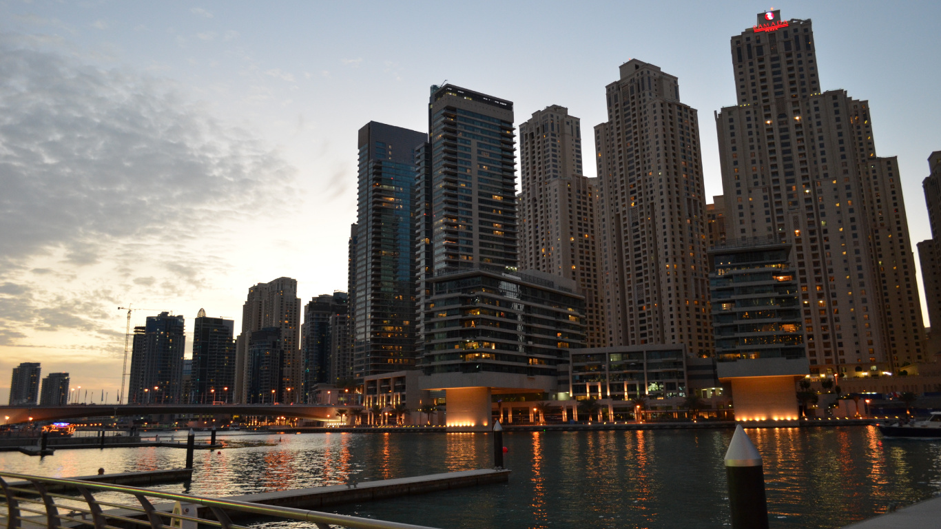 City Skyline Across Body of Water During Night Time. Wallpaper in 1366x768 Resolution