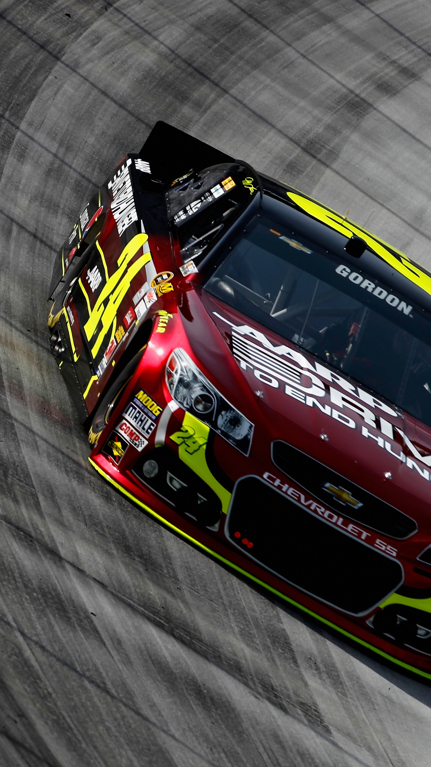 Red and Blue Racing Car on Gray Textile. Wallpaper in 1440x2560 Resolution