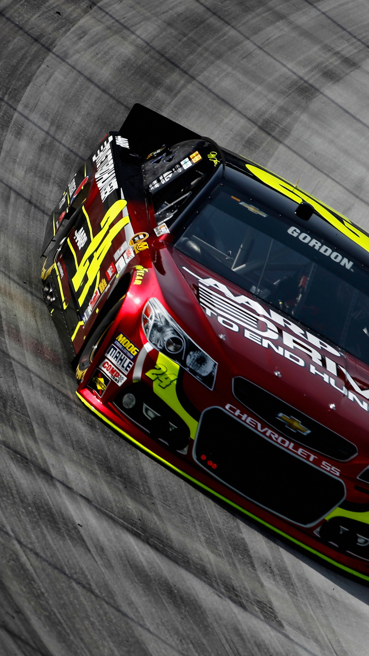 Red and Blue Racing Car on Gray Textile. Wallpaper in 750x1334 Resolution
