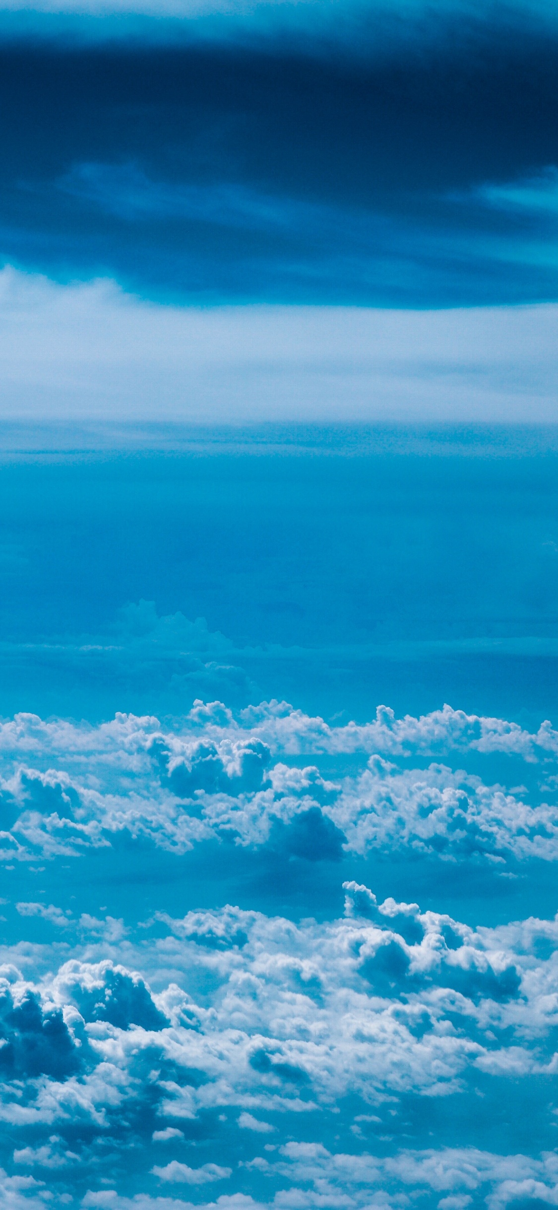 White Clouds and Blue Sky. Wallpaper in 1125x2436 Resolution