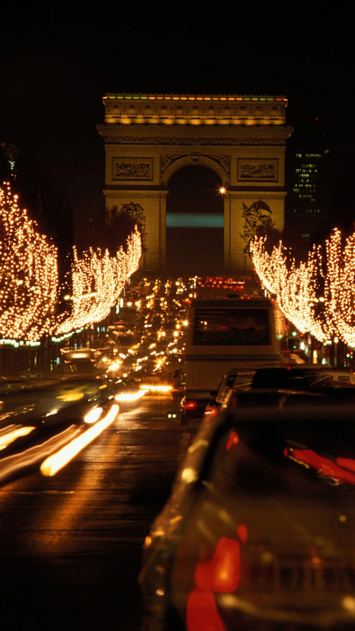 Cars on Road Near Lighted Building During Night Time. Wallpaper in 720x1280 Resolution