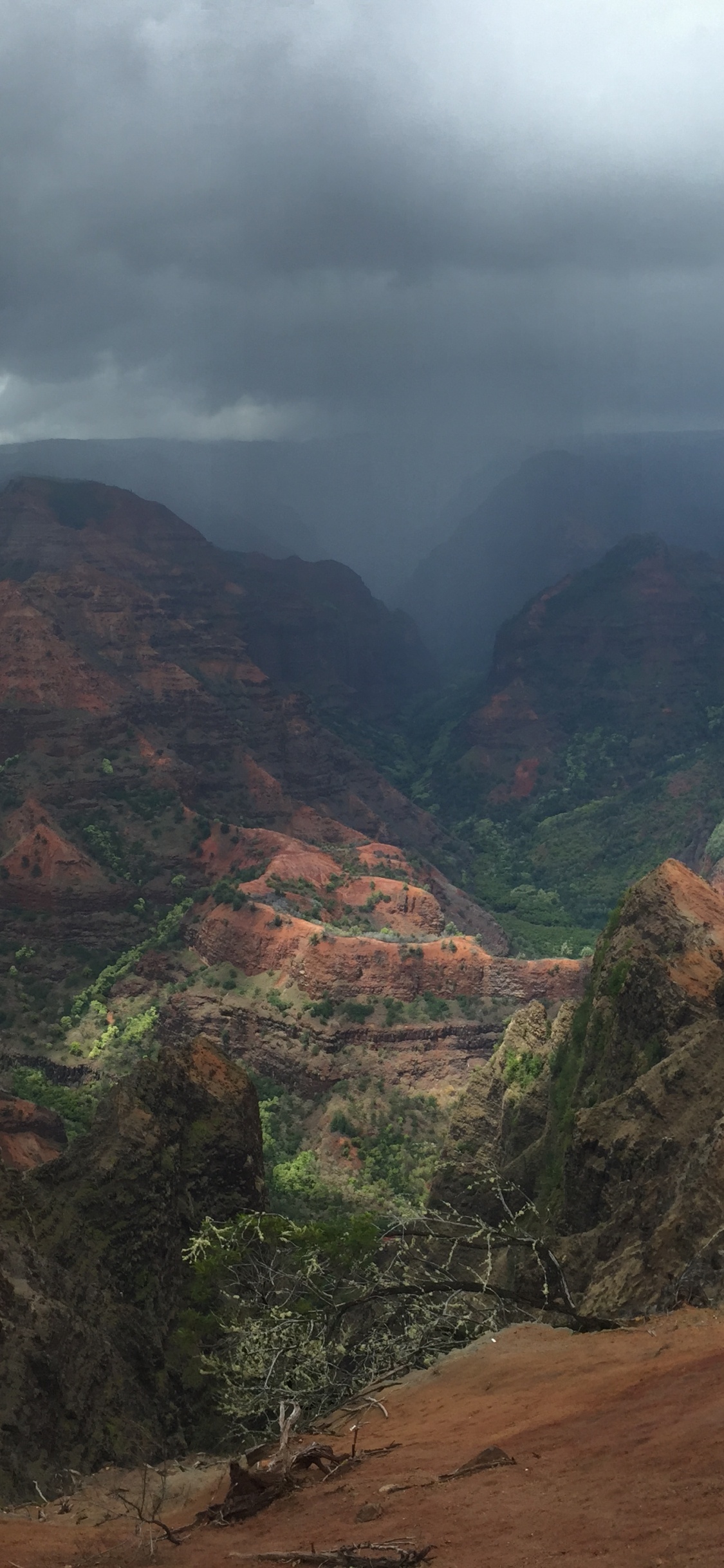 Brown and Green Mountains Under Cloudy Sky During Daytime. Wallpaper in 1125x2436 Resolution