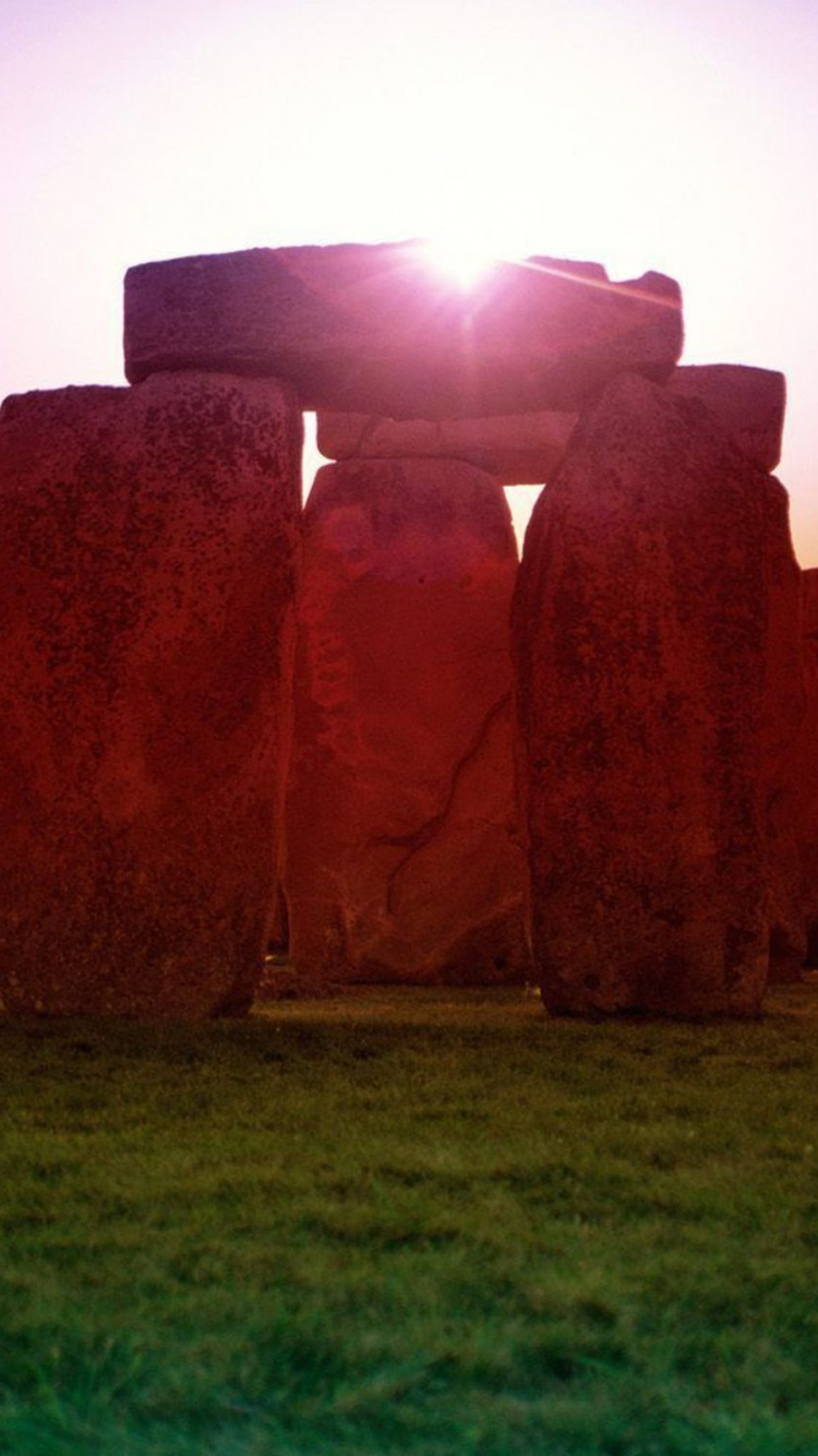 Brown Rock Formation on Green Grass Field During Daytime. Wallpaper in 750x1334 Resolution