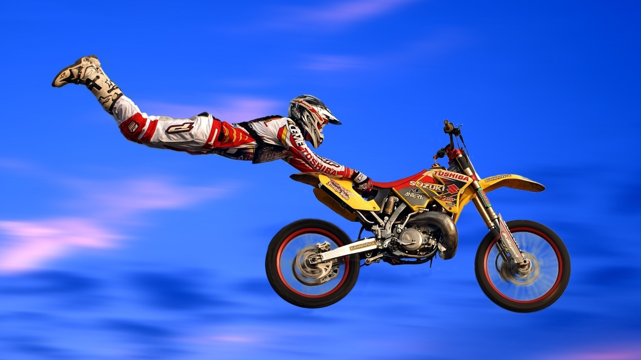 Man Riding Motocross Dirt Bike. Wallpaper in 1280x720 Resolution