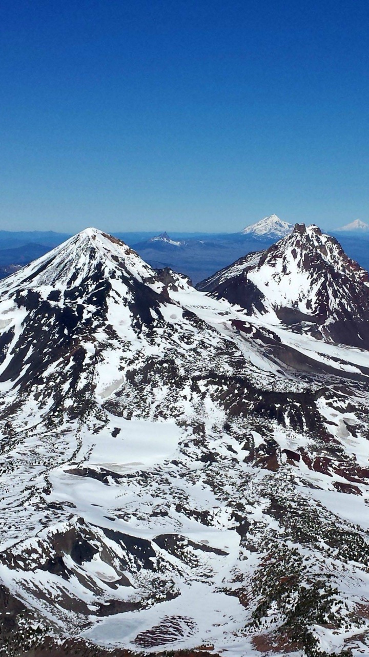 Snow Covered Mountain Under Blue Sky During Daytime. Wallpaper in 720x1280 Resolution