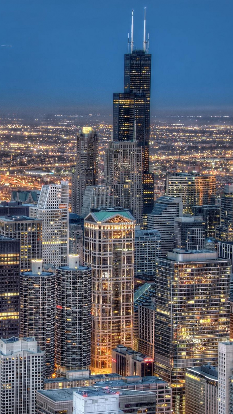 Vue Aérienne Des Bâtiments de la Ville Pendant la Nuit. Wallpaper in 750x1334 Resolution