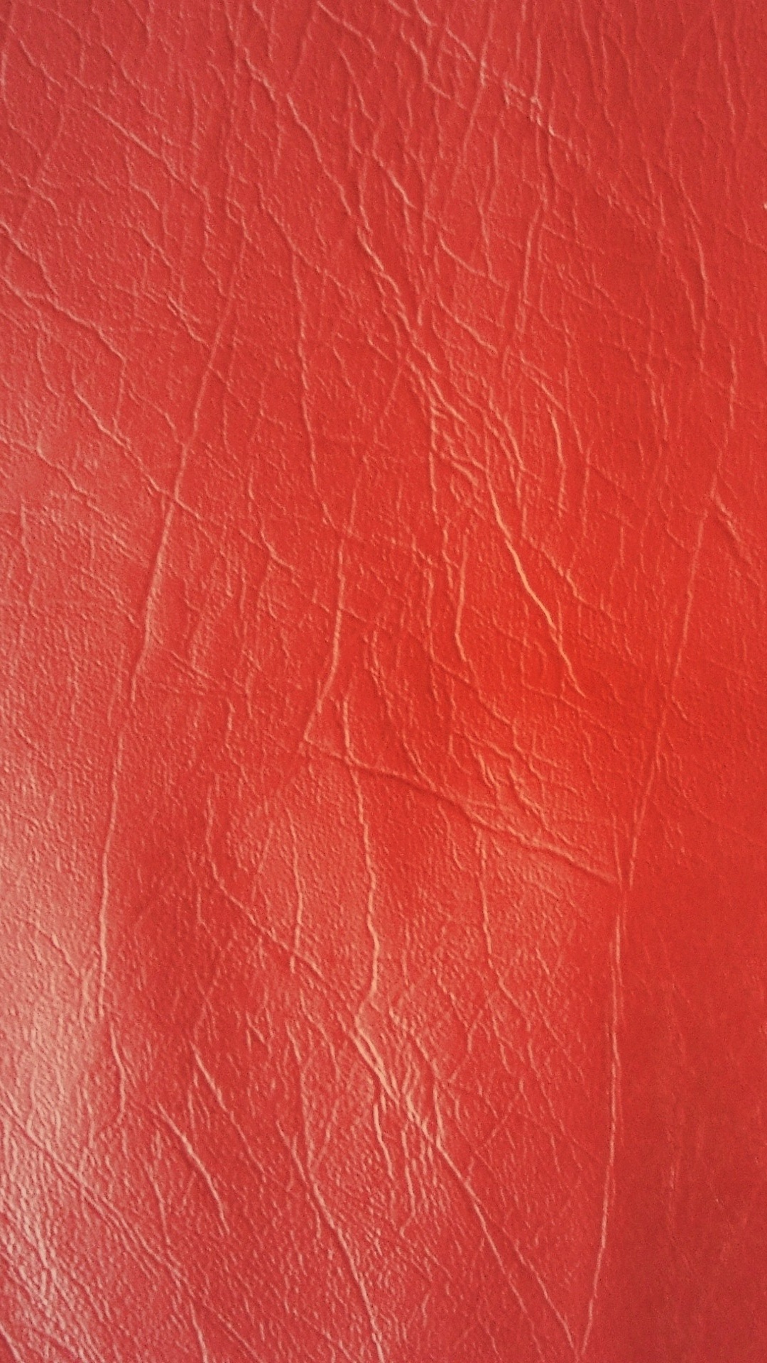 Rotes Ledertextil in Nahaufnahmen. Wallpaper in 1080x1920 Resolution