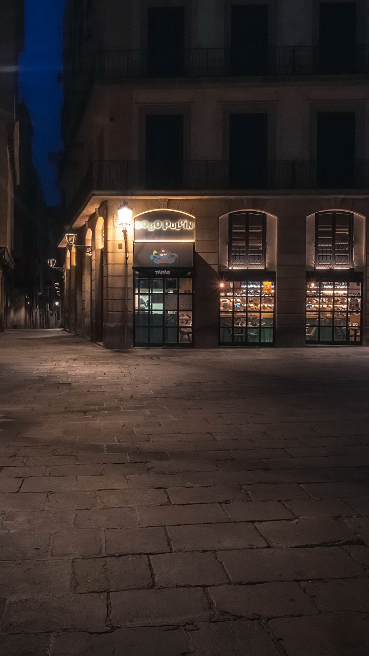 Brown Concrete Building During Night Time. Wallpaper in 720x1280 Resolution