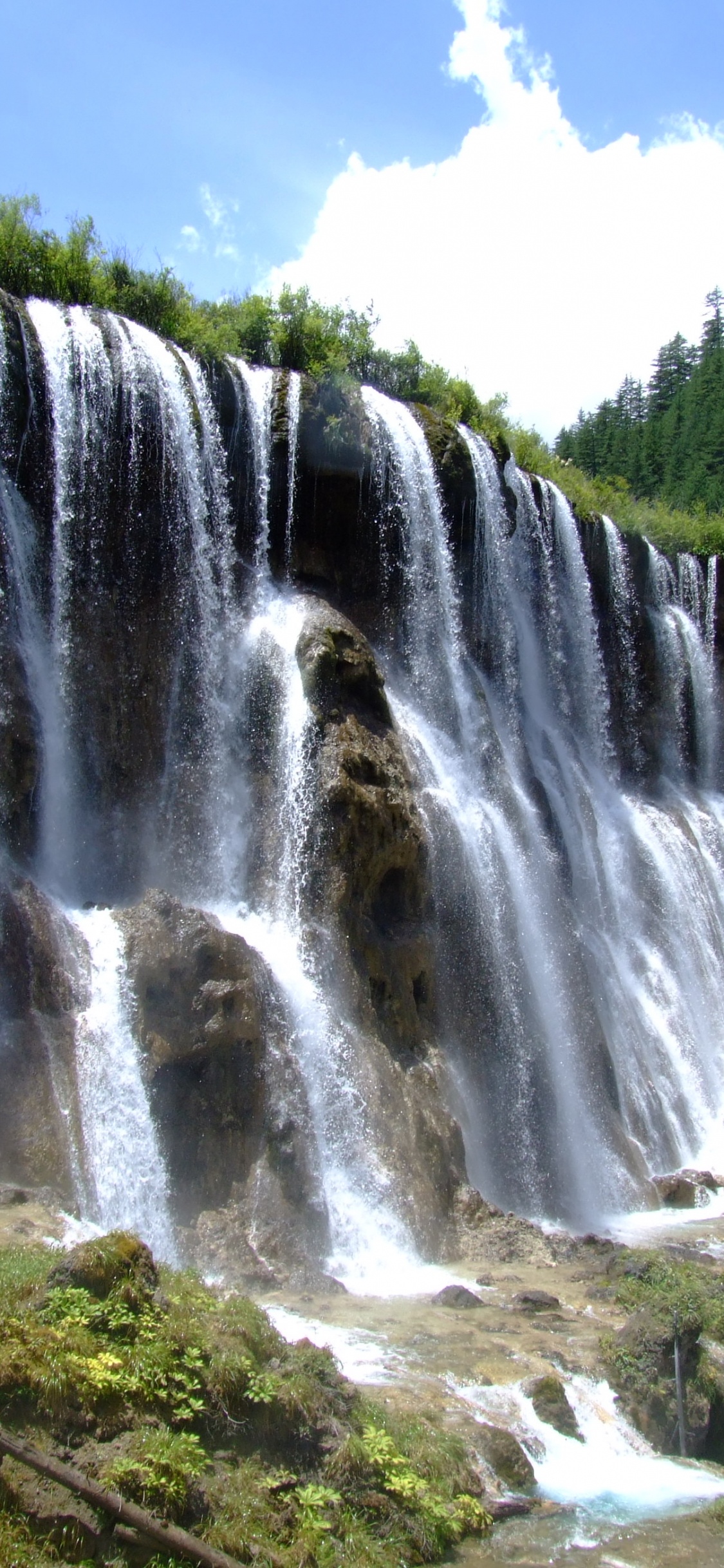 Waterfalls Under Blue Sky During Daytime. Wallpaper in 1125x2436 Resolution