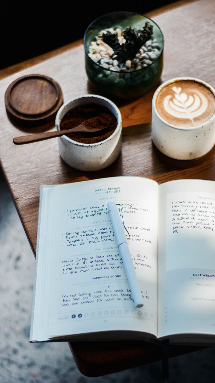 White Printer Paper Beside White Ceramic Mug on Brown Wooden Table. Wallpaper in 750x1334 Resolution