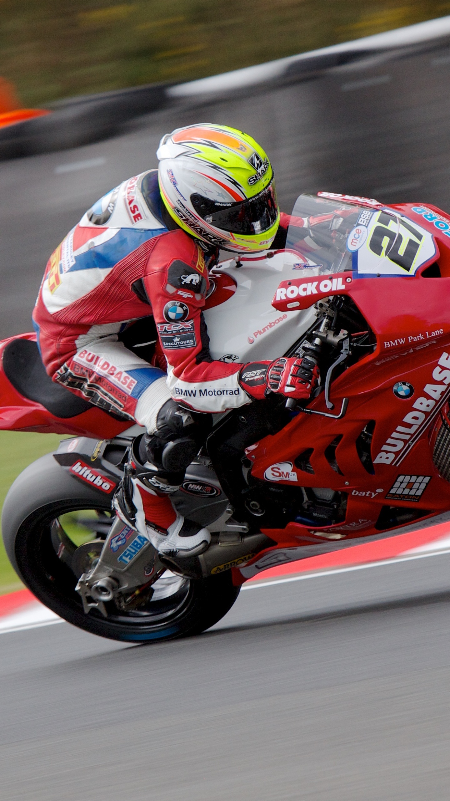 Man in Red and Black Motorcycle Suit Riding on Red Sports Bike. Wallpaper in 1440x2560 Resolution