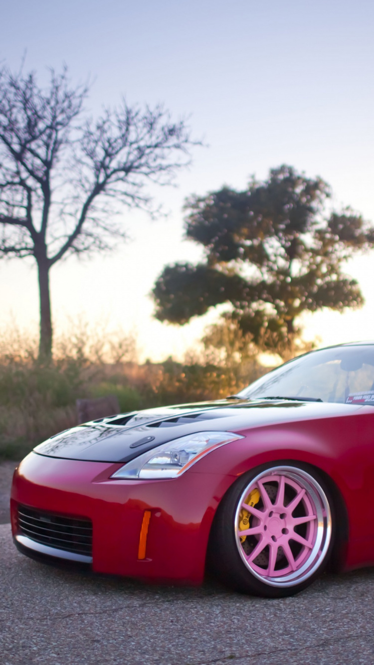 Roter Porsche 911 Tagsüber Unterwegs. Wallpaper in 750x1334 Resolution