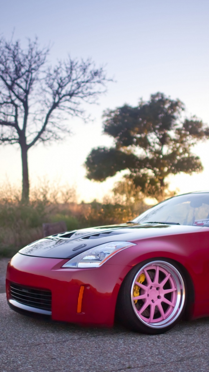 Porsche 911 Rojo en la Carretera Durante el Día. Wallpaper in 720x1280 Resolution