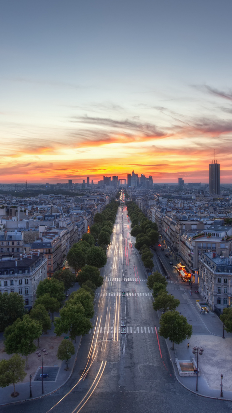 City Buildings Under Orange Sky During Sunset. Wallpaper in 750x1334 Resolution