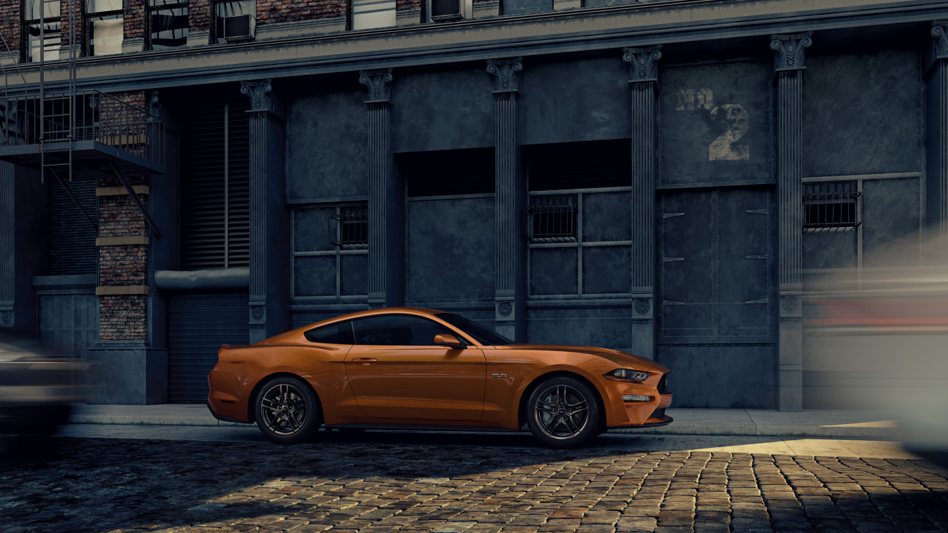 Orange Car Parked Beside Building. Wallpaper in 1366x768 Resolution