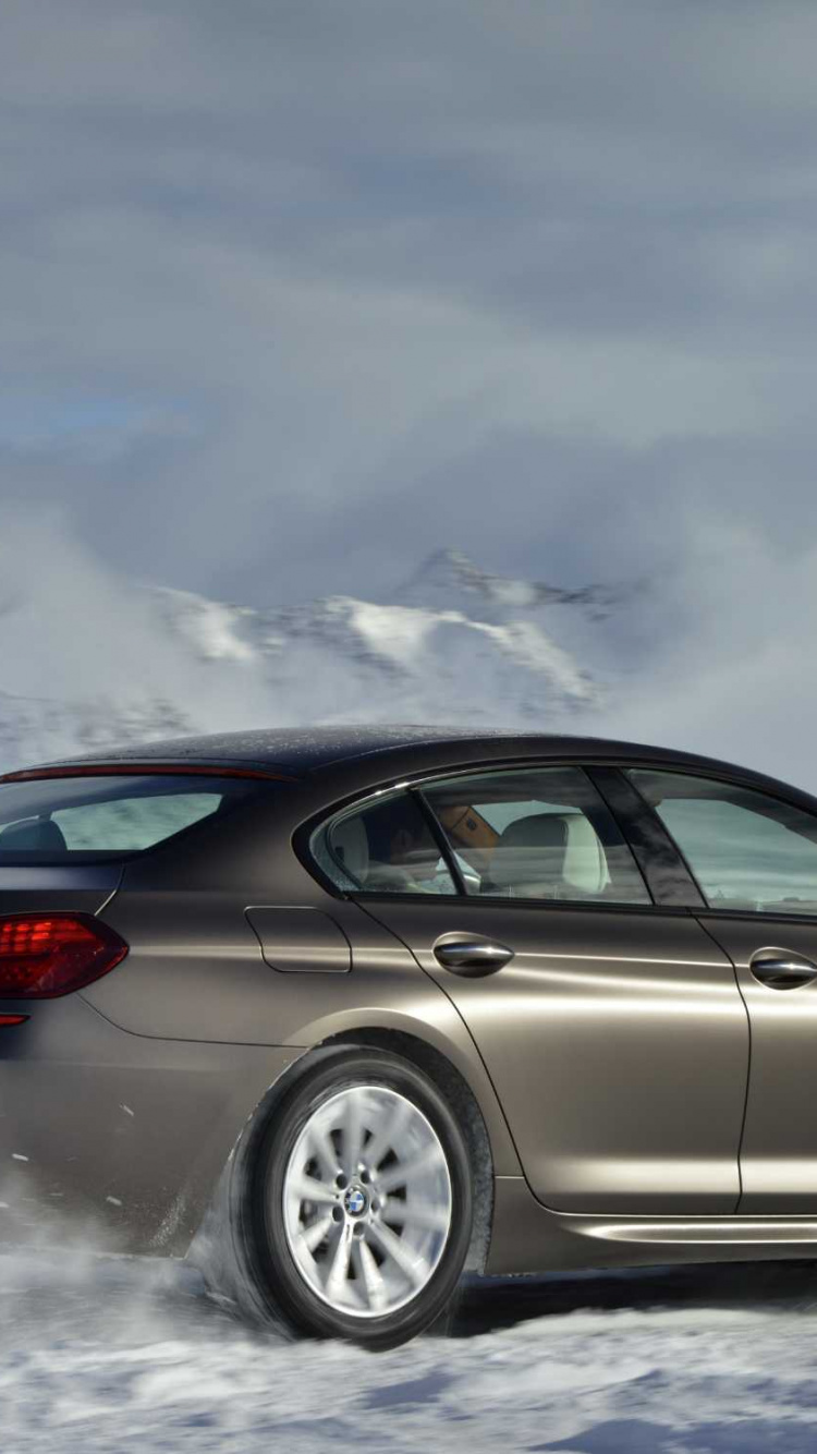 Silver Coupe on Snow Covered Ground. Wallpaper in 750x1334 Resolution