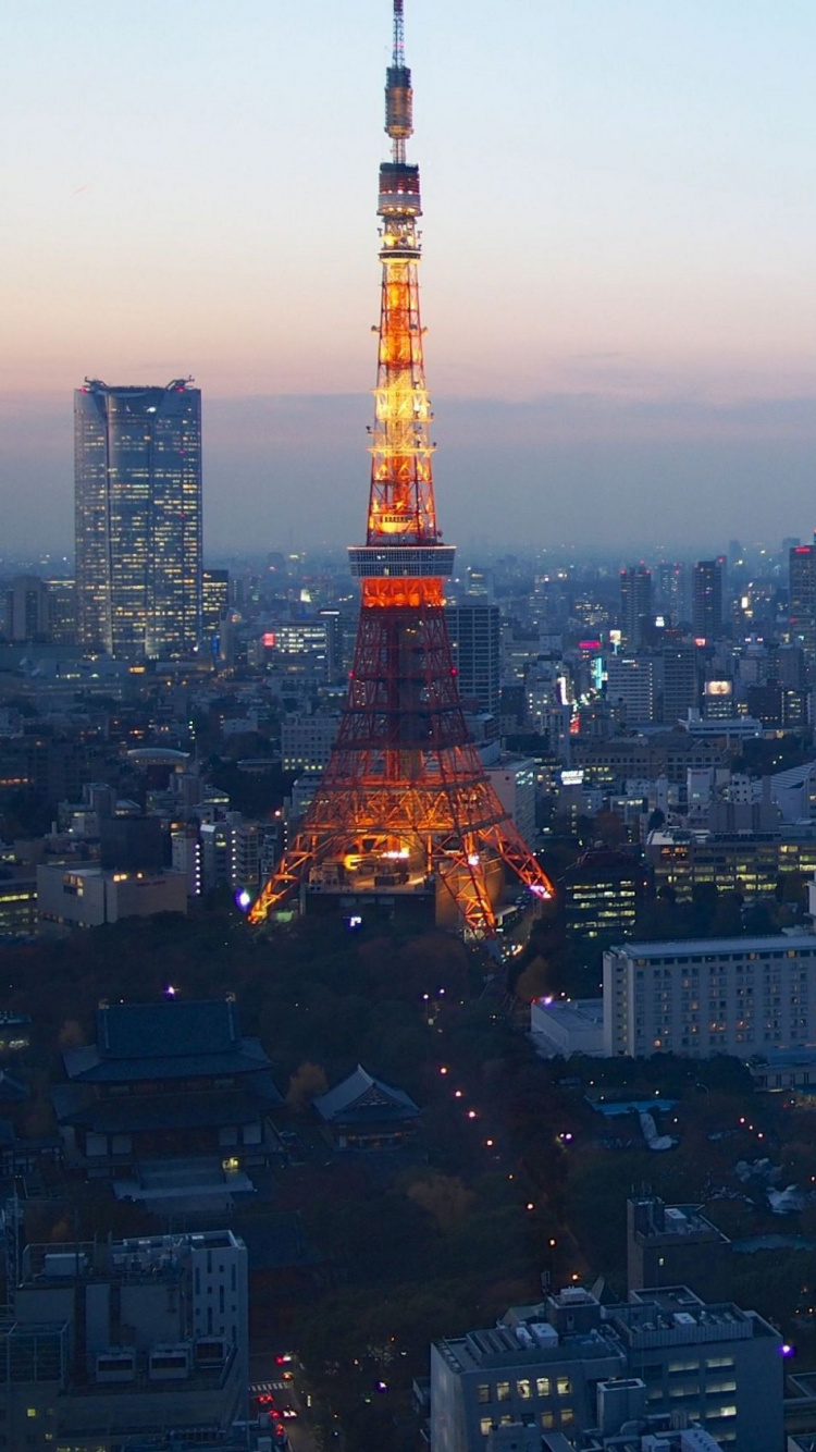 Orange and White Tower in The City During Sunset. Wallpaper in 750x1334 Resolution