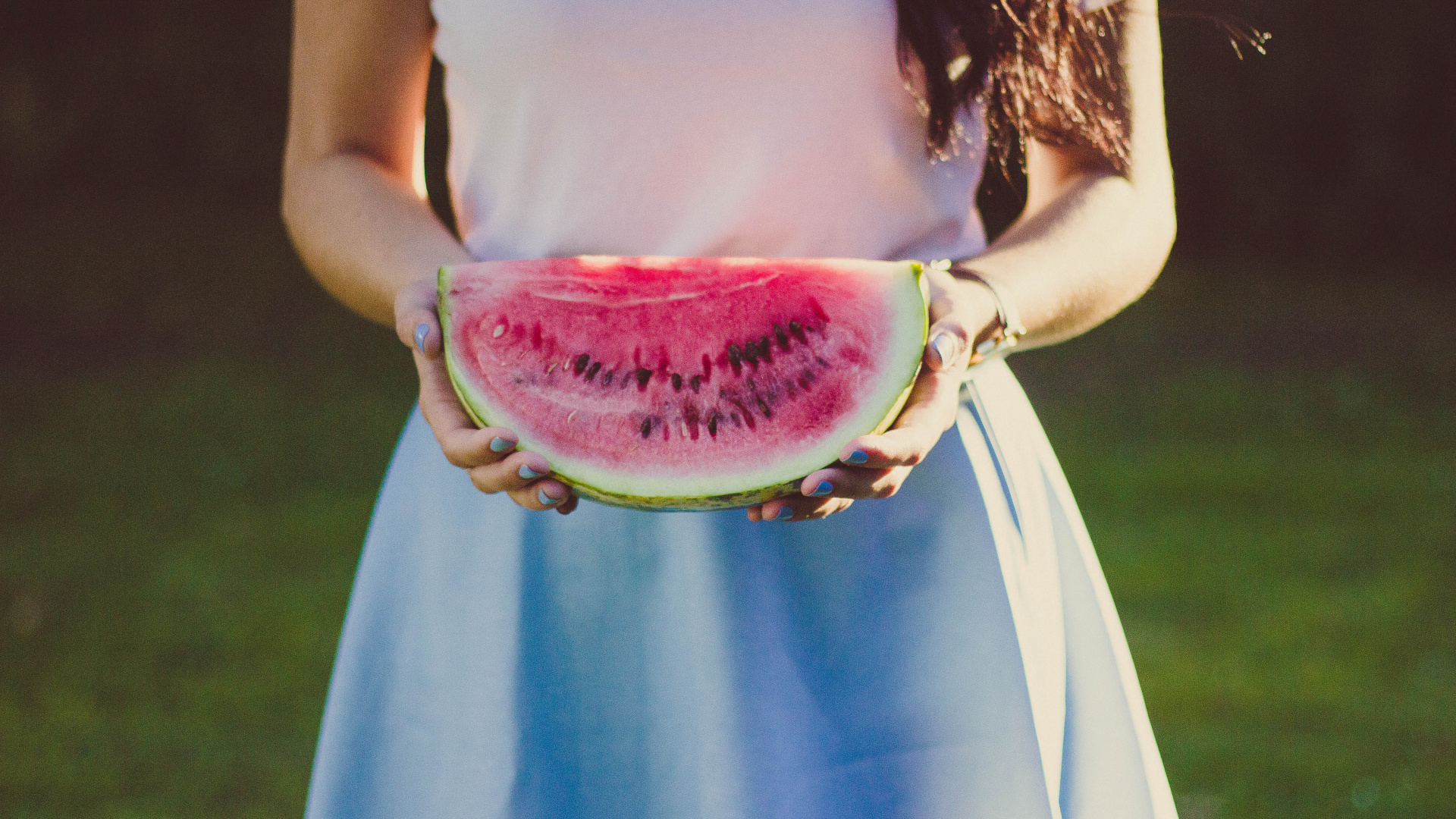 Woman in White and Blue Dress Holding Sliced Watermelon. Wallpaper in 1920x1080 Resolution