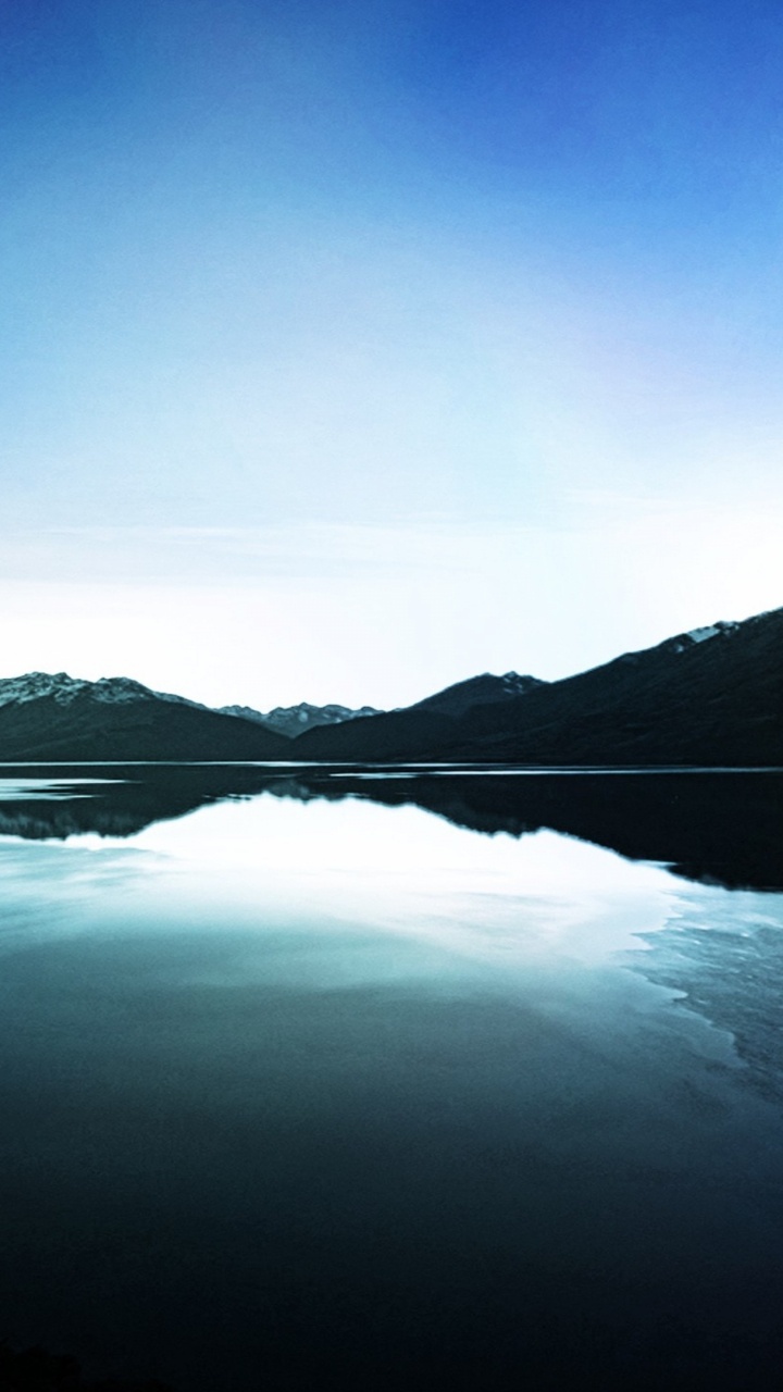 Body of Water Near Mountain During Daytime. Wallpaper in 720x1280 Resolution