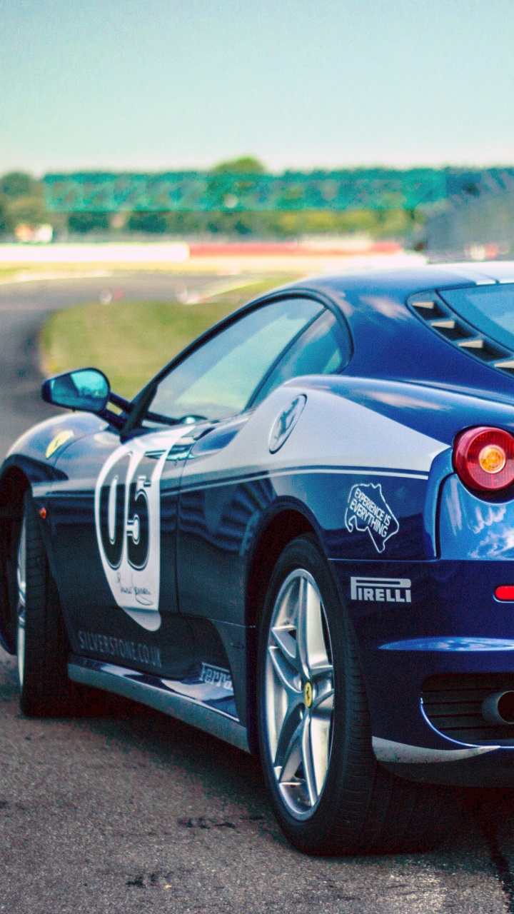 Rot-schwarzer Porsche 911 Tagsüber Unterwegs. Wallpaper in 720x1280 Resolution