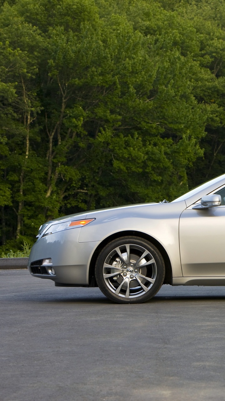 Silver Sedan Parked on Gray Asphalt Road. Wallpaper in 720x1280 Resolution