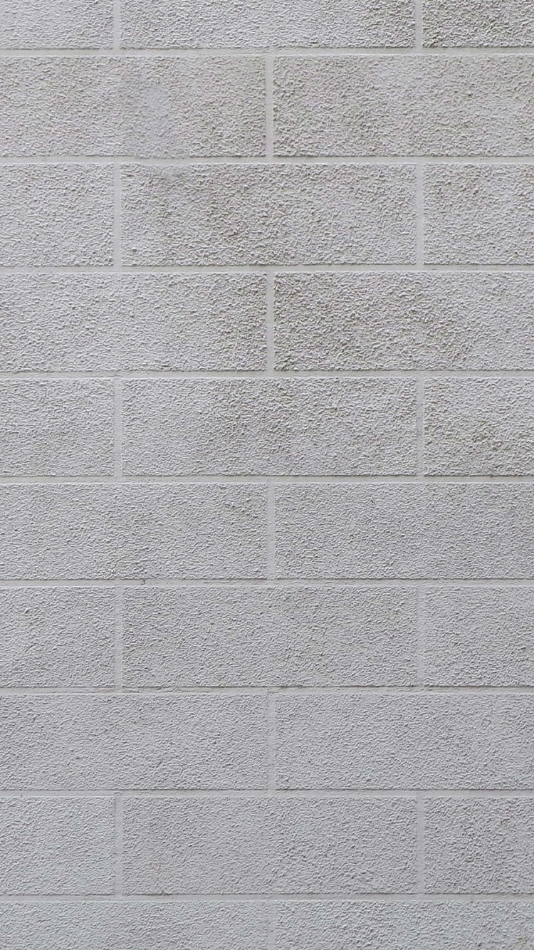 Graue Backsteinmauer Tagsüber. Wallpaper in 750x1334 Resolution