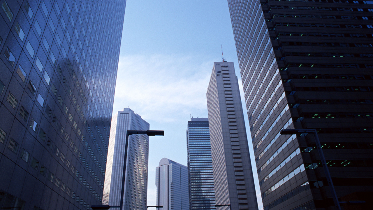 White and Blue High Rise Buildings Under Blue Sky During Daytime. Wallpaper in 1280x720 Resolution