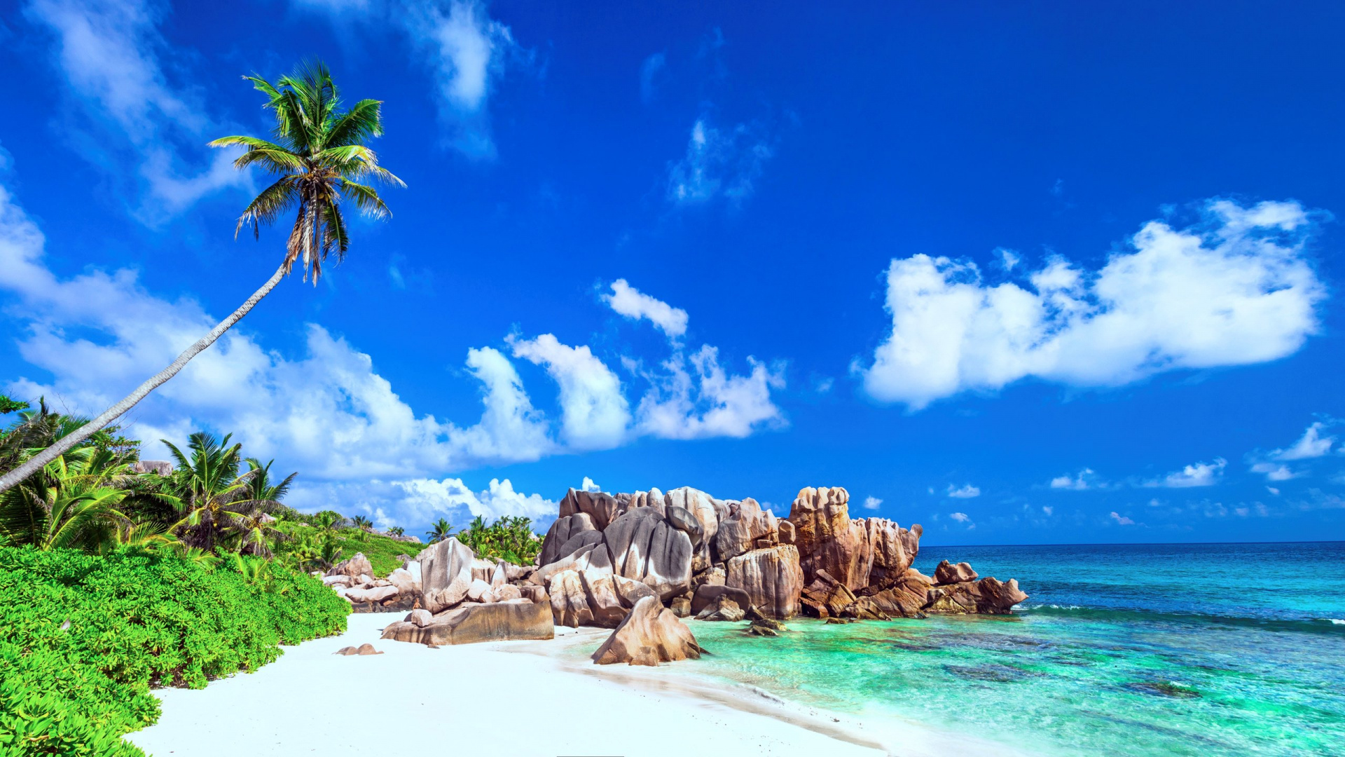 Brown Rocky Mountain Beside Body of Water Under Blue Sky and White Clouds During Daytime. Wallpaper in 1920x1080 Resolution