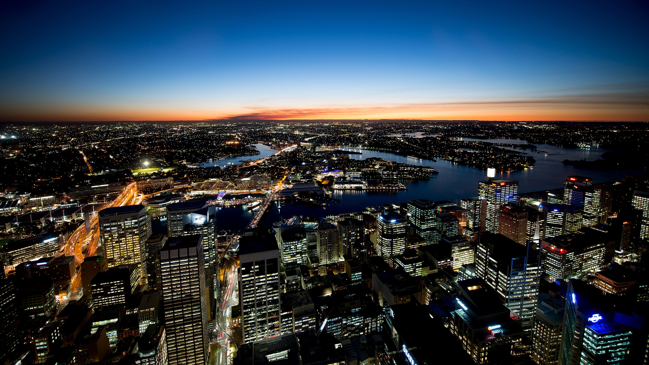 Aerial View of City Buildings During Night Time. Wallpaper in 2560x1440 Resolution