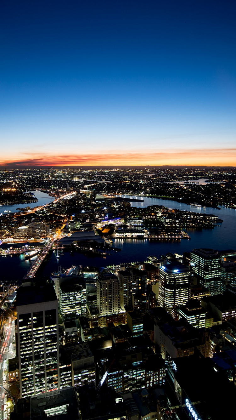 Aerial View of City Buildings During Night Time. Wallpaper in 750x1334 Resolution