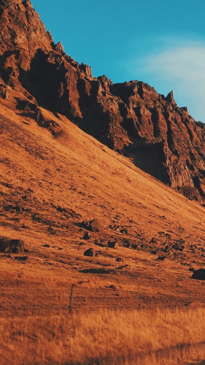 Brown Mountain Under Blue Sky During Daytime. Wallpaper in 720x1280 Resolution
