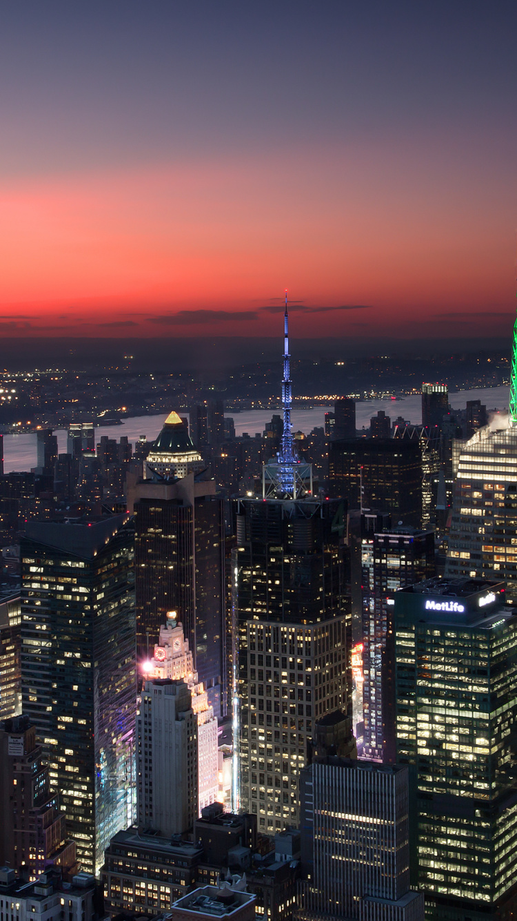 Aerial View of City Buildings During Night Time. Wallpaper in 750x1334 Resolution