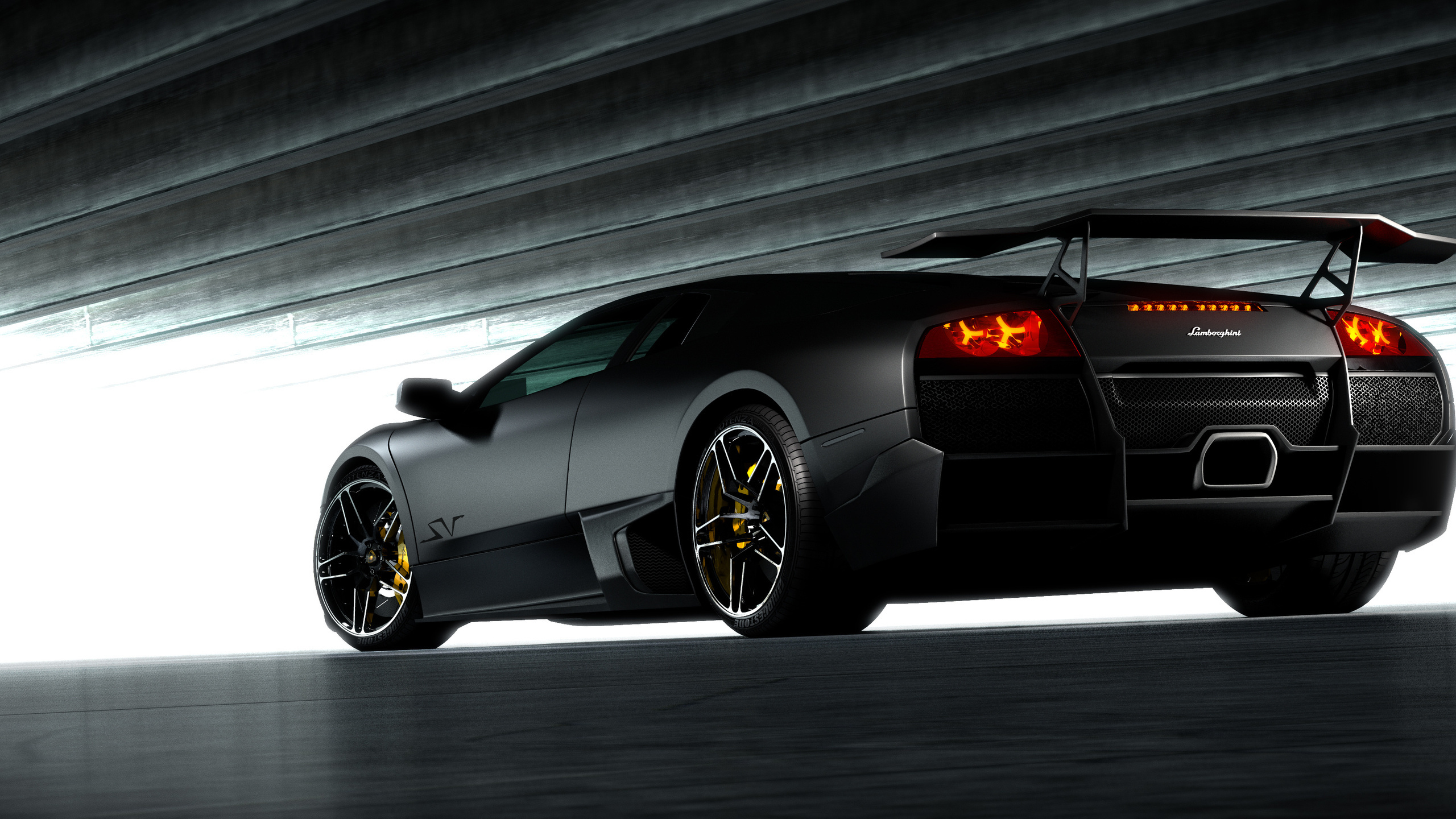 Black Porsche 911 Parked in Front of White and Gray Building. Wallpaper in 2560x1440 Resolution