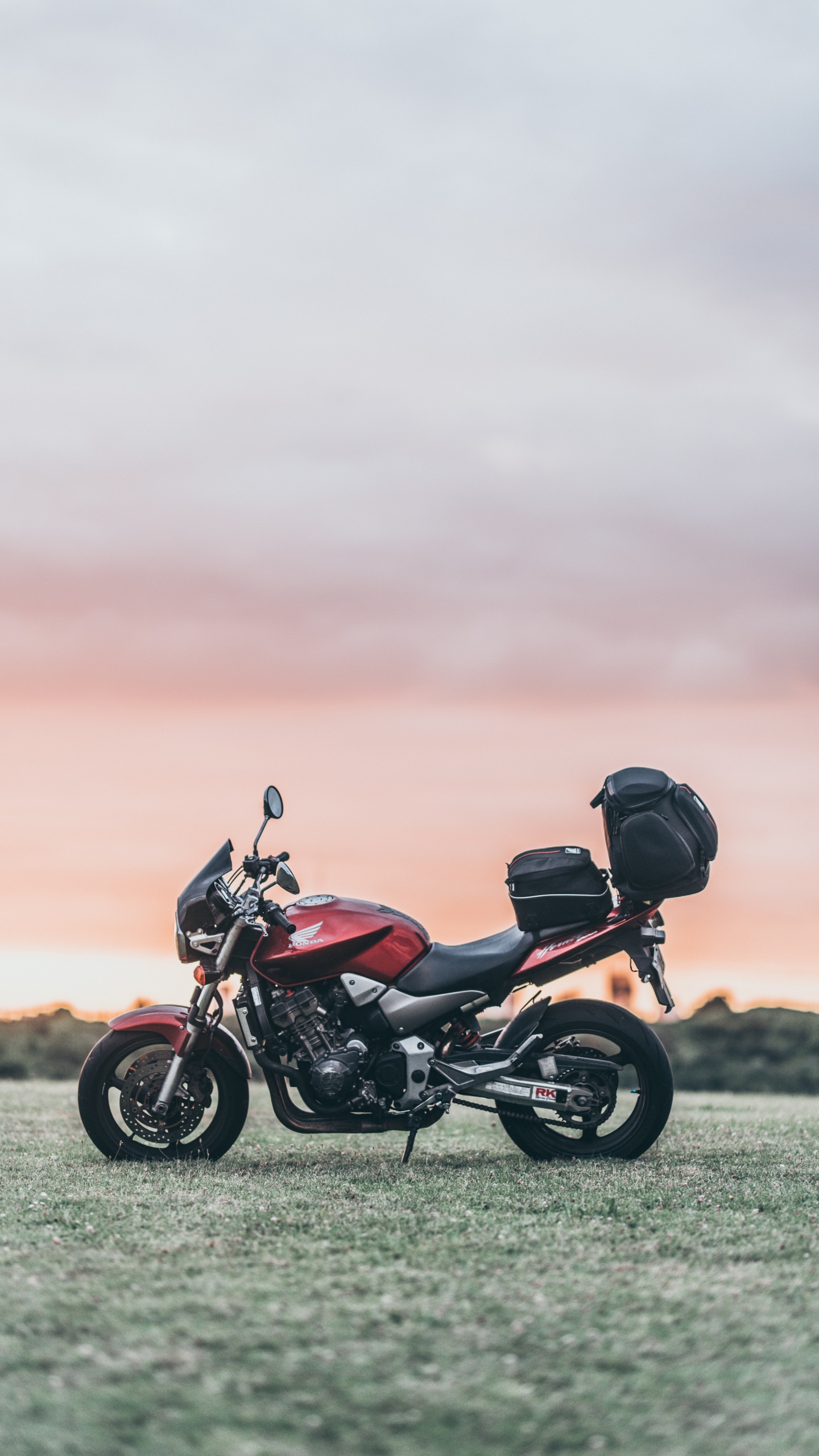 Black and Red Motorcycle on Green Grass Field During Daytime. Wallpaper in 1440x2560 Resolution