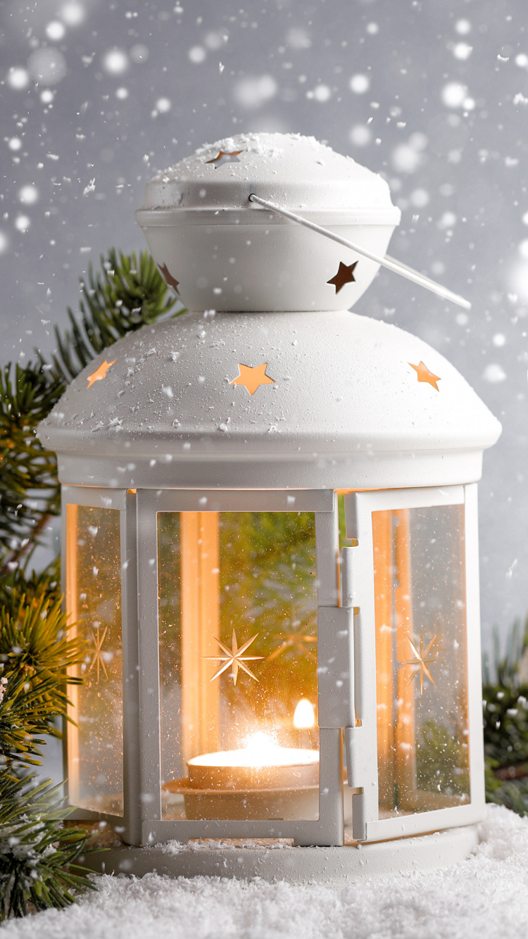 White Lantern on Snow Covered Ground. Wallpaper in 750x1334 Resolution