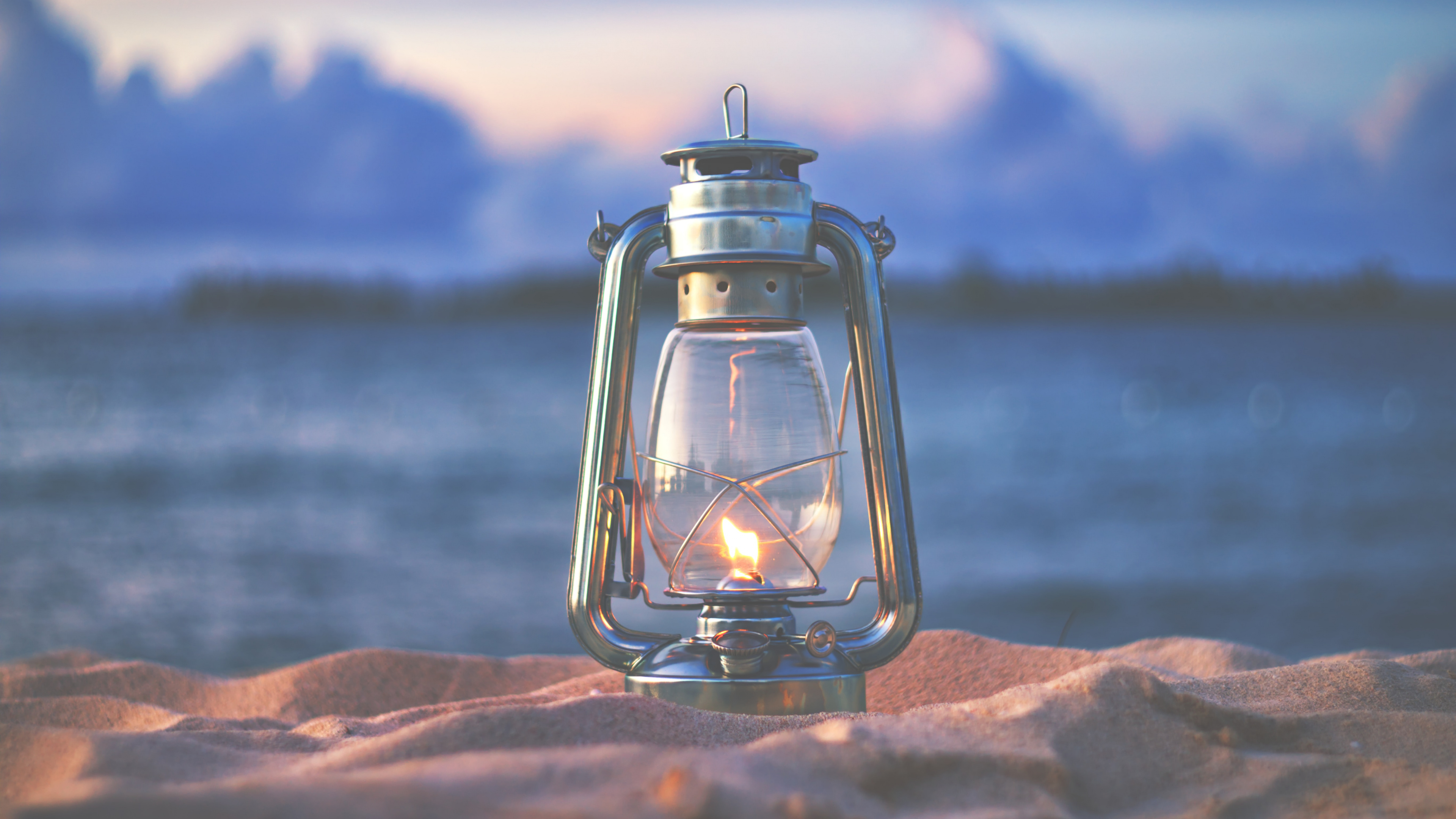 Clear Glass Candle Lantern on Brown Rock. Wallpaper in 3840x2160 Resolution