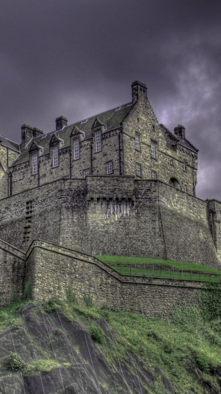 Gray Concrete Castle Under Cloudy Sky. Wallpaper in 720x1280 Resolution
