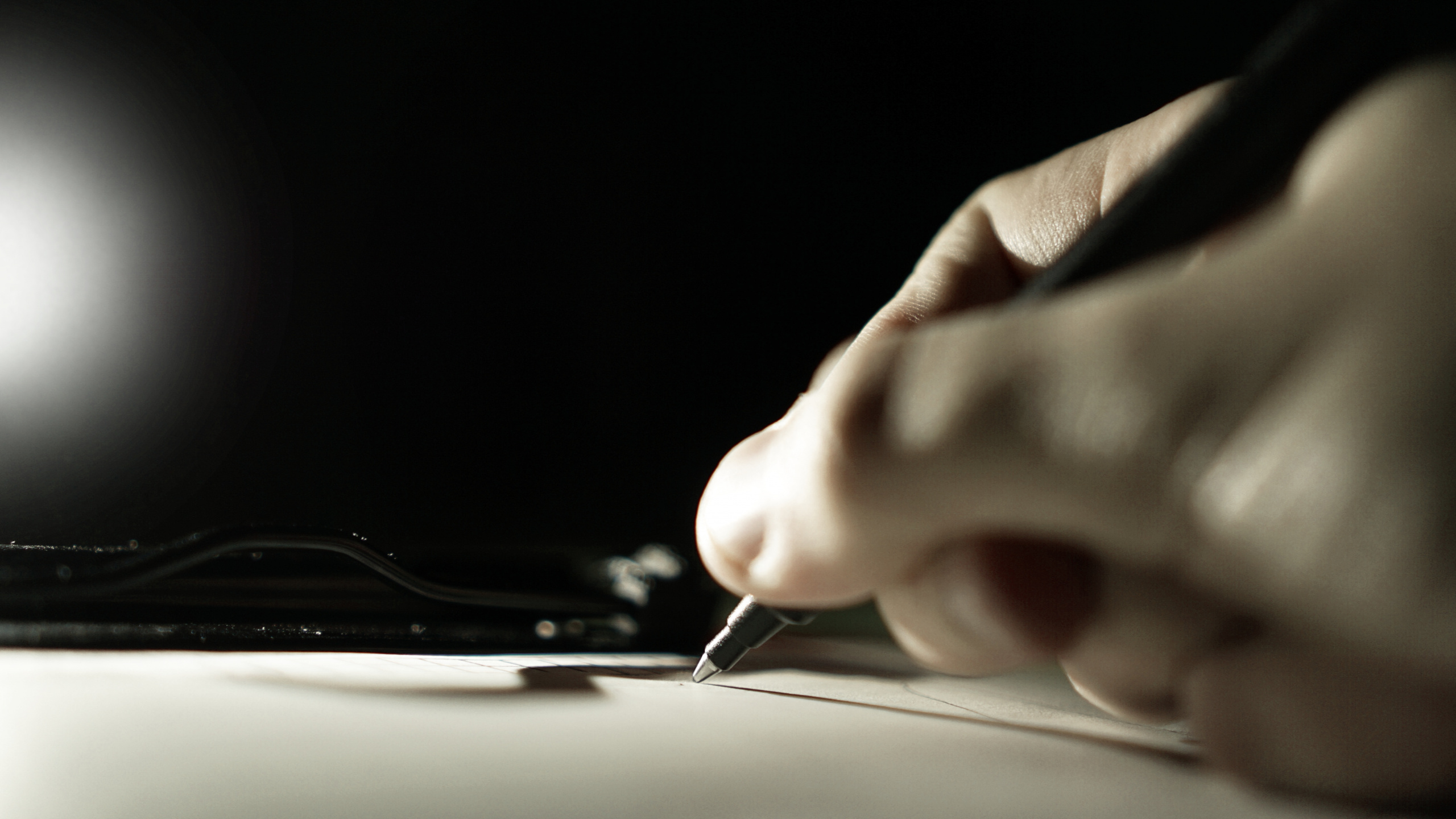 Person Writing on White Paper. Wallpaper in 2560x1440 Resolution