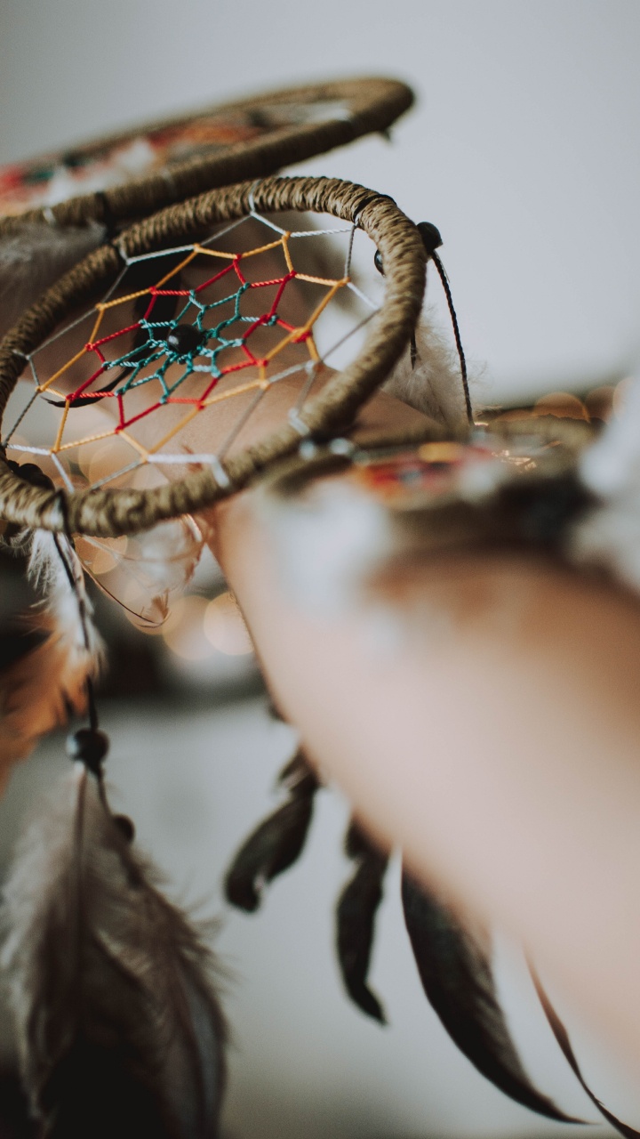Person Holding Brown and Green Round Mirror. Wallpaper in 720x1280 Resolution
