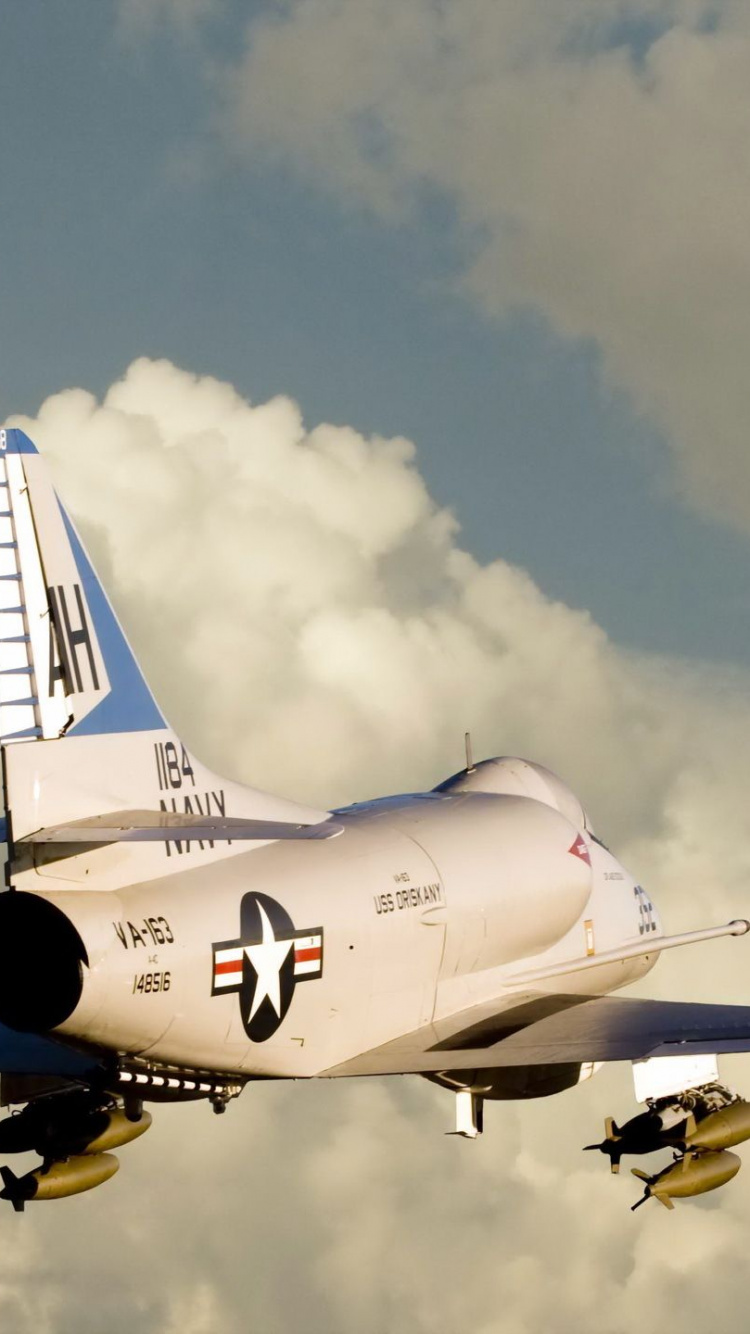 White and Blue Airplane Flying in The Sky. Wallpaper in 750x1334 Resolution