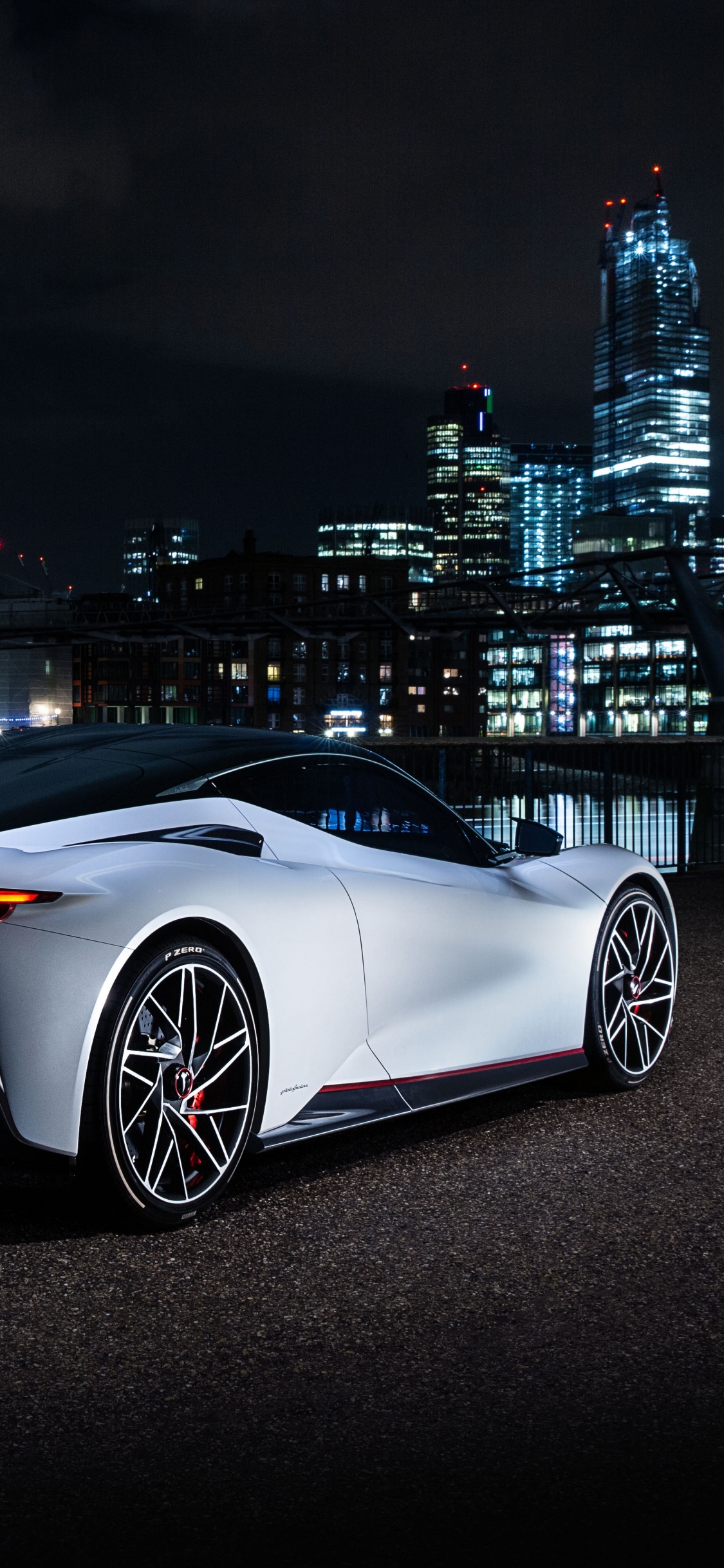 White Coupe Parked on Black Asphalt Road During Night Time. Wallpaper in 1125x2436 Resolution