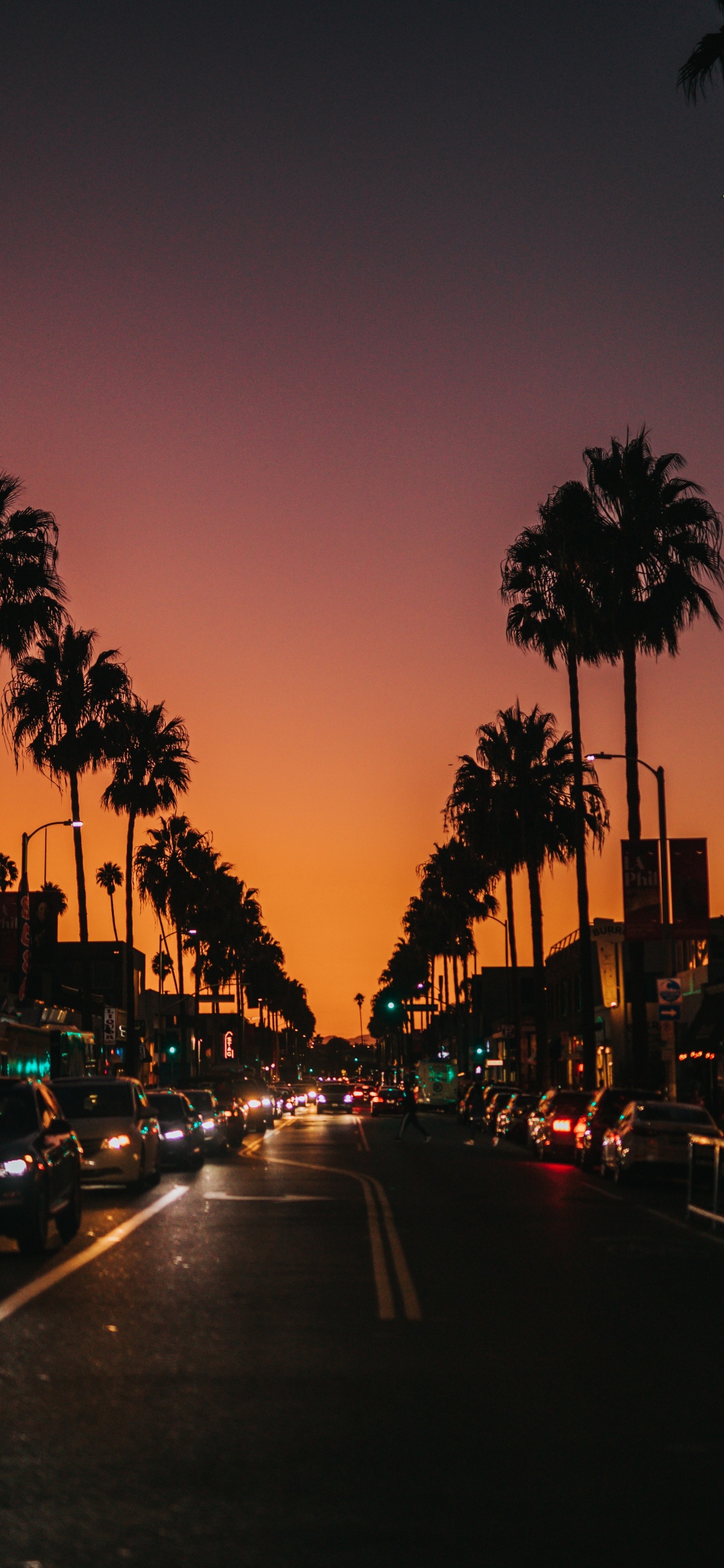 Cars on Road During Sunset. Wallpaper in 1125x2436 Resolution