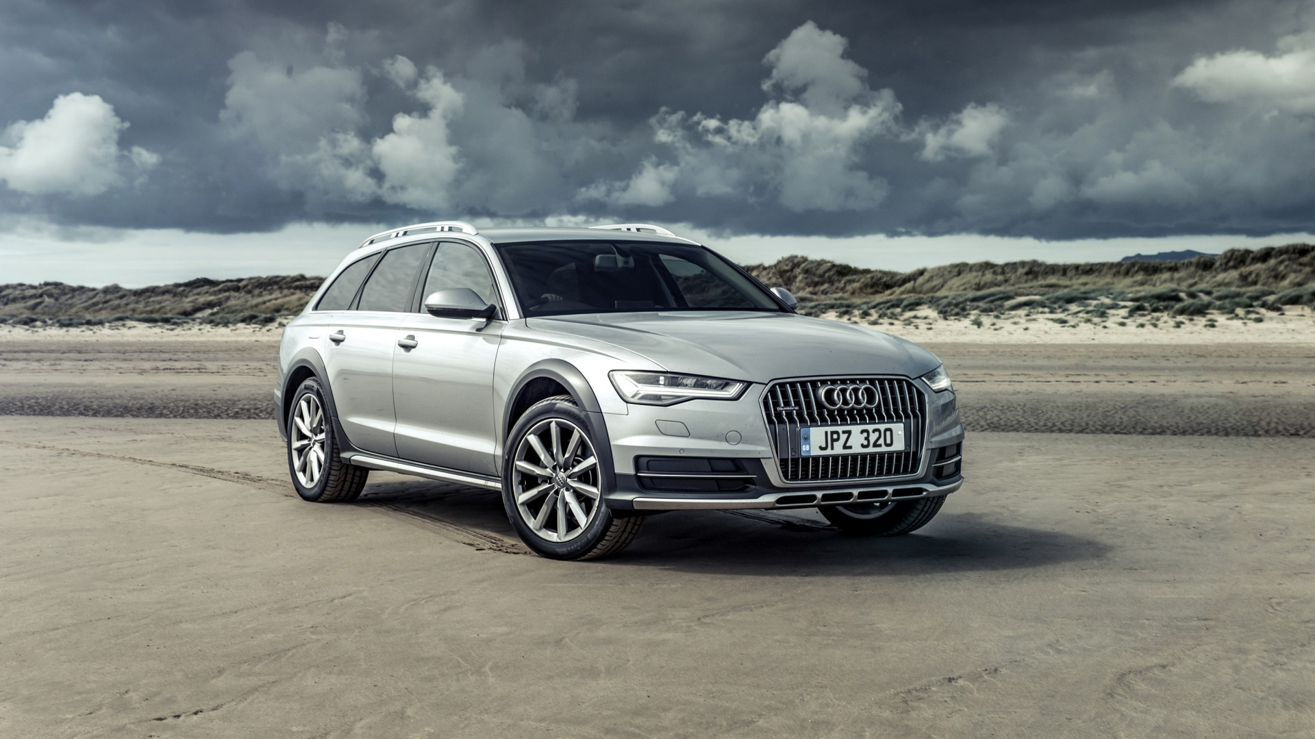 Silver Audi a 4 on Brown Field Under White Clouds and Blue Sky During Daytime. Wallpaper in 1920x1080 Resolution