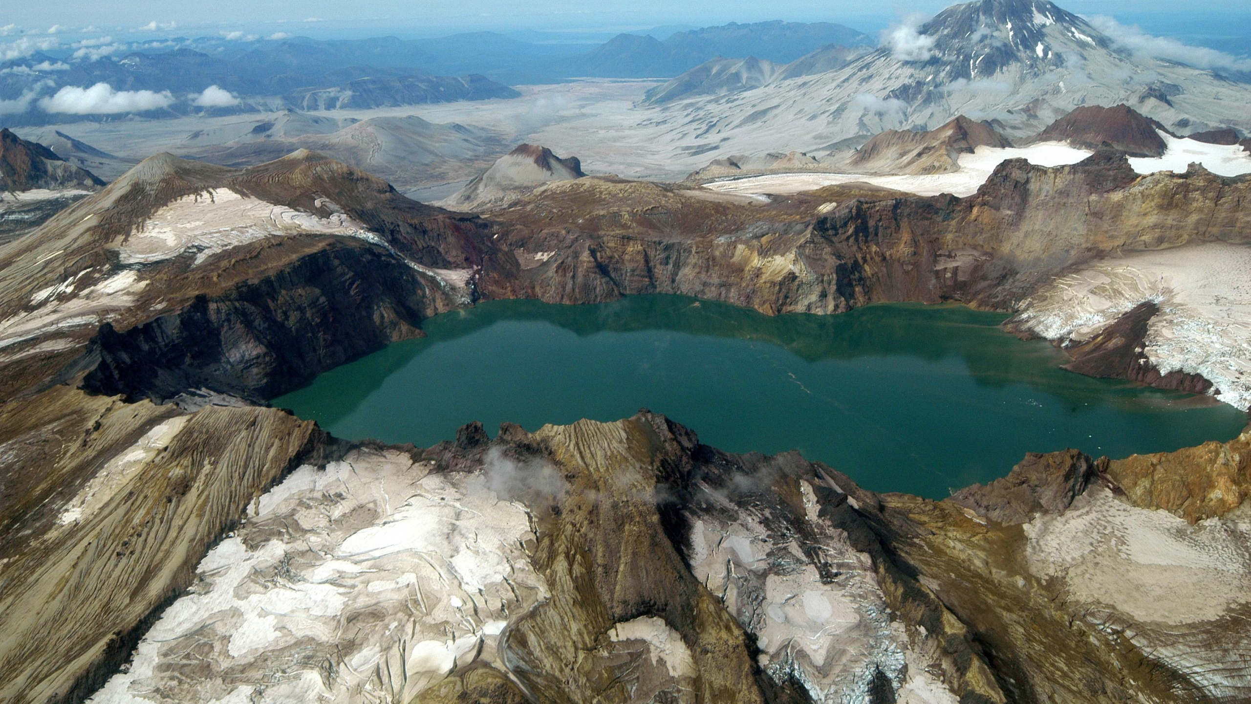 Aerial View of Lake Between Mountains During Daytime. Wallpaper in 2560x1440 Resolution