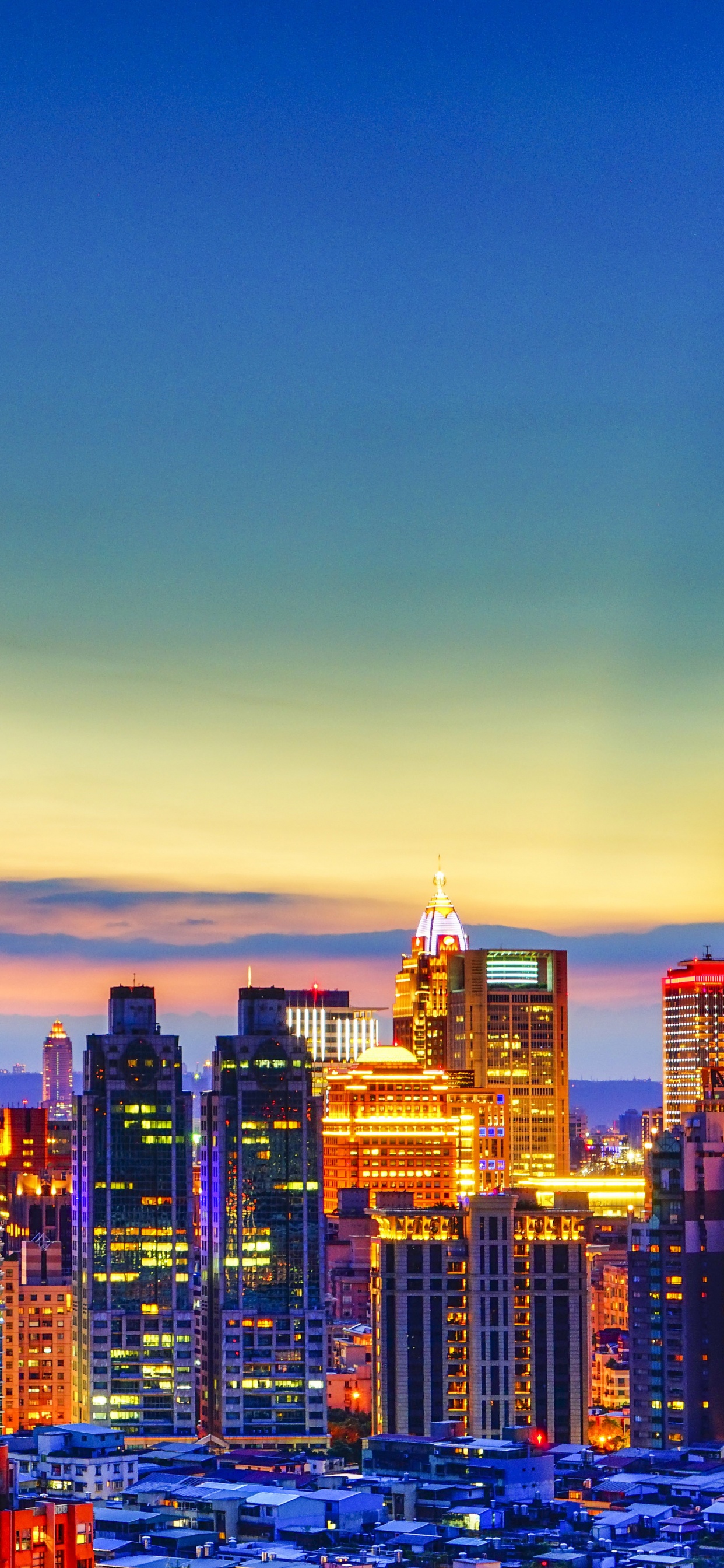 City Skyline During Night Time. Wallpaper in 1242x2688 Resolution