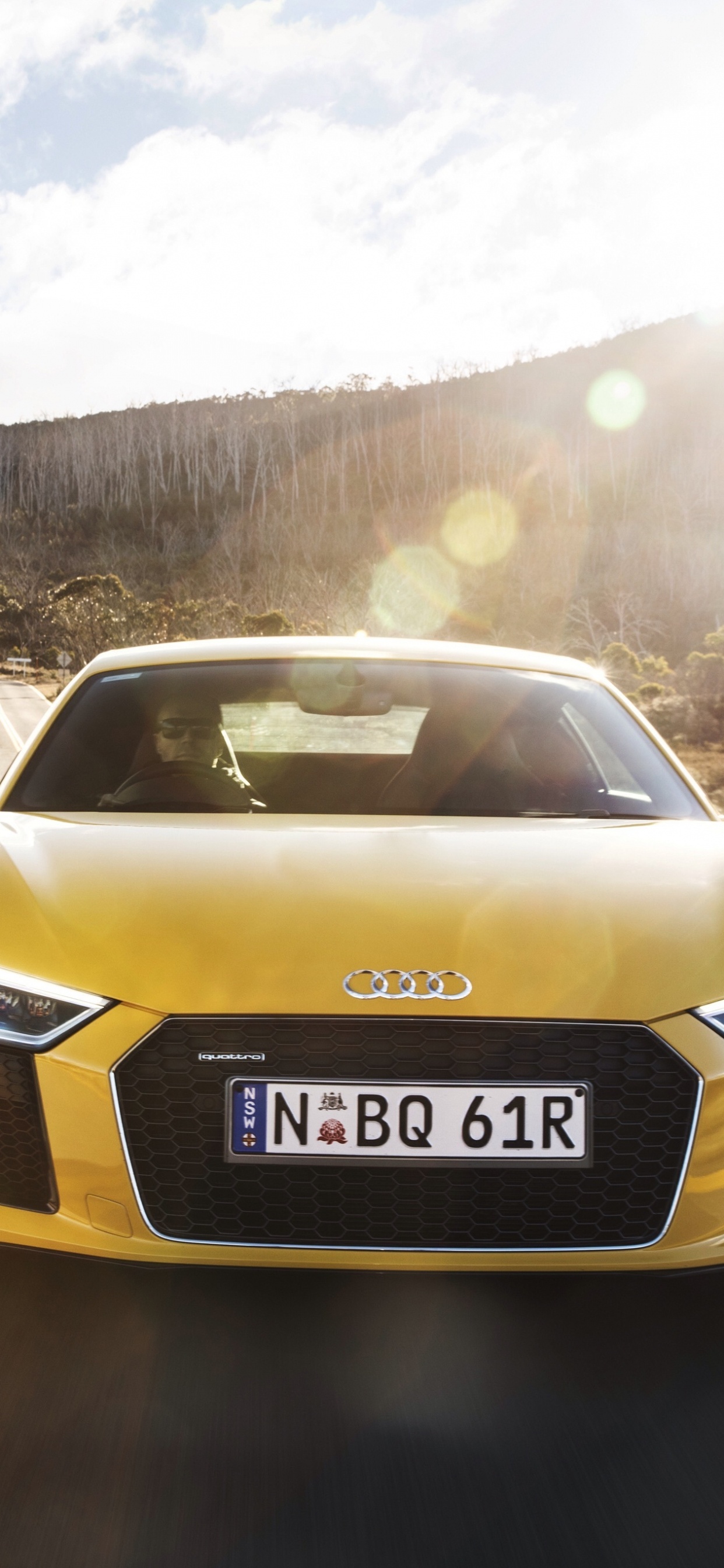 Audi Jaune a 4 Sur Route Pendant la Journée. Wallpaper in 1242x2688 Resolution
