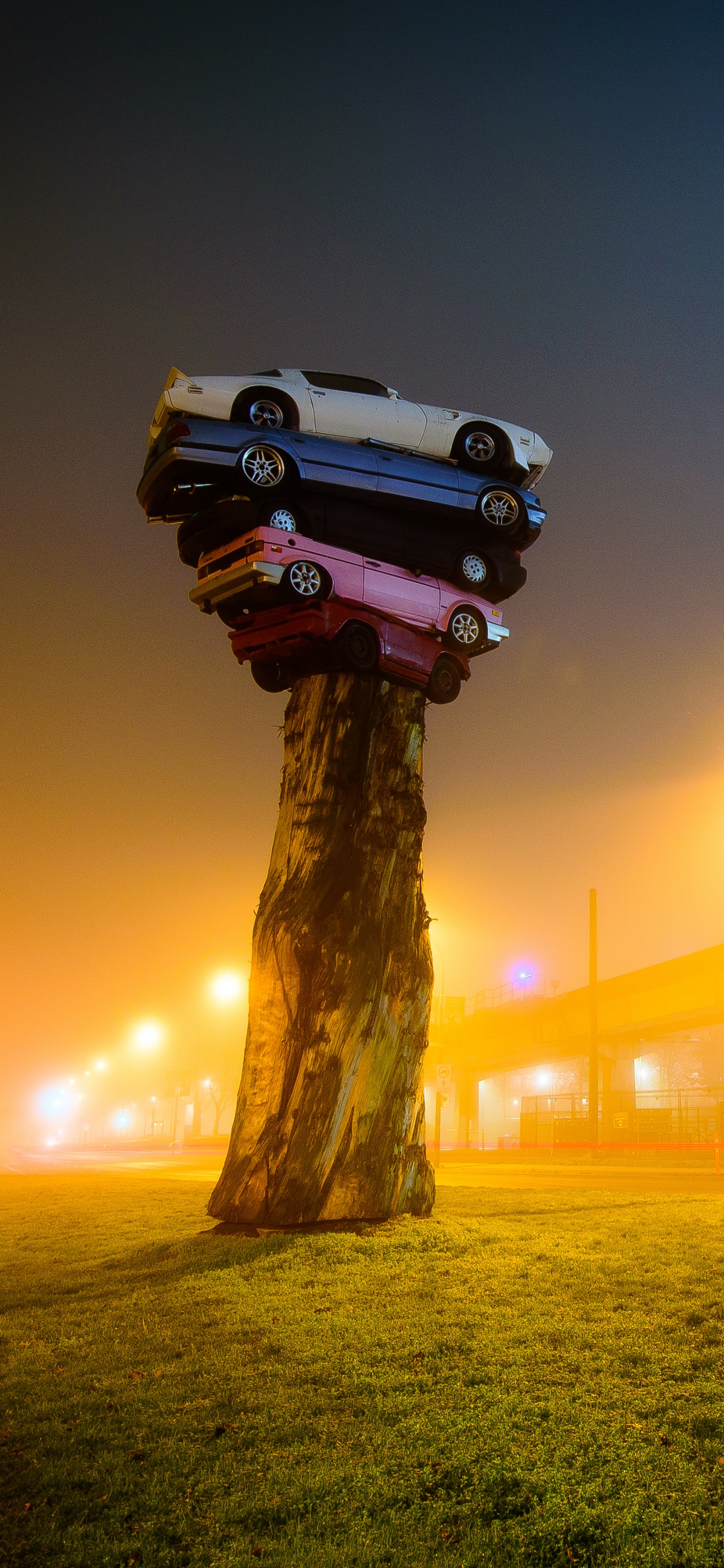Brown Wooden Post With Light During Night Time. Wallpaper in 1242x2688 Resolution