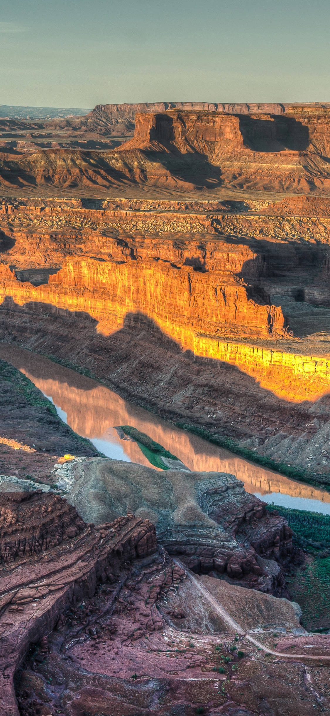 Brown and Green Mountains Under Blue Sky During Daytime. Wallpaper in 1125x2436 Resolution