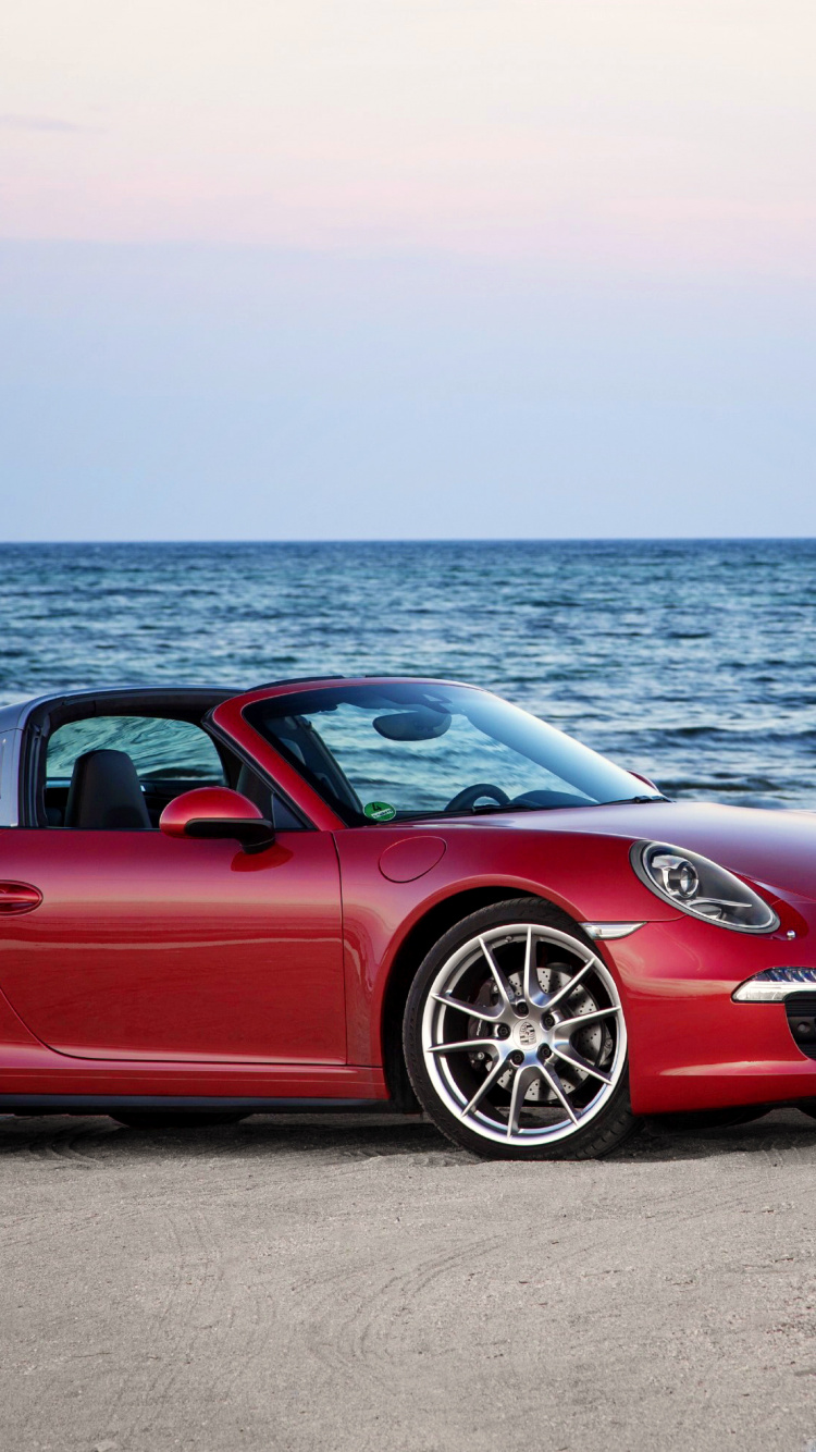Red Ferrari Sports Car on Beach During Daytime. Wallpaper in 750x1334 Resolution